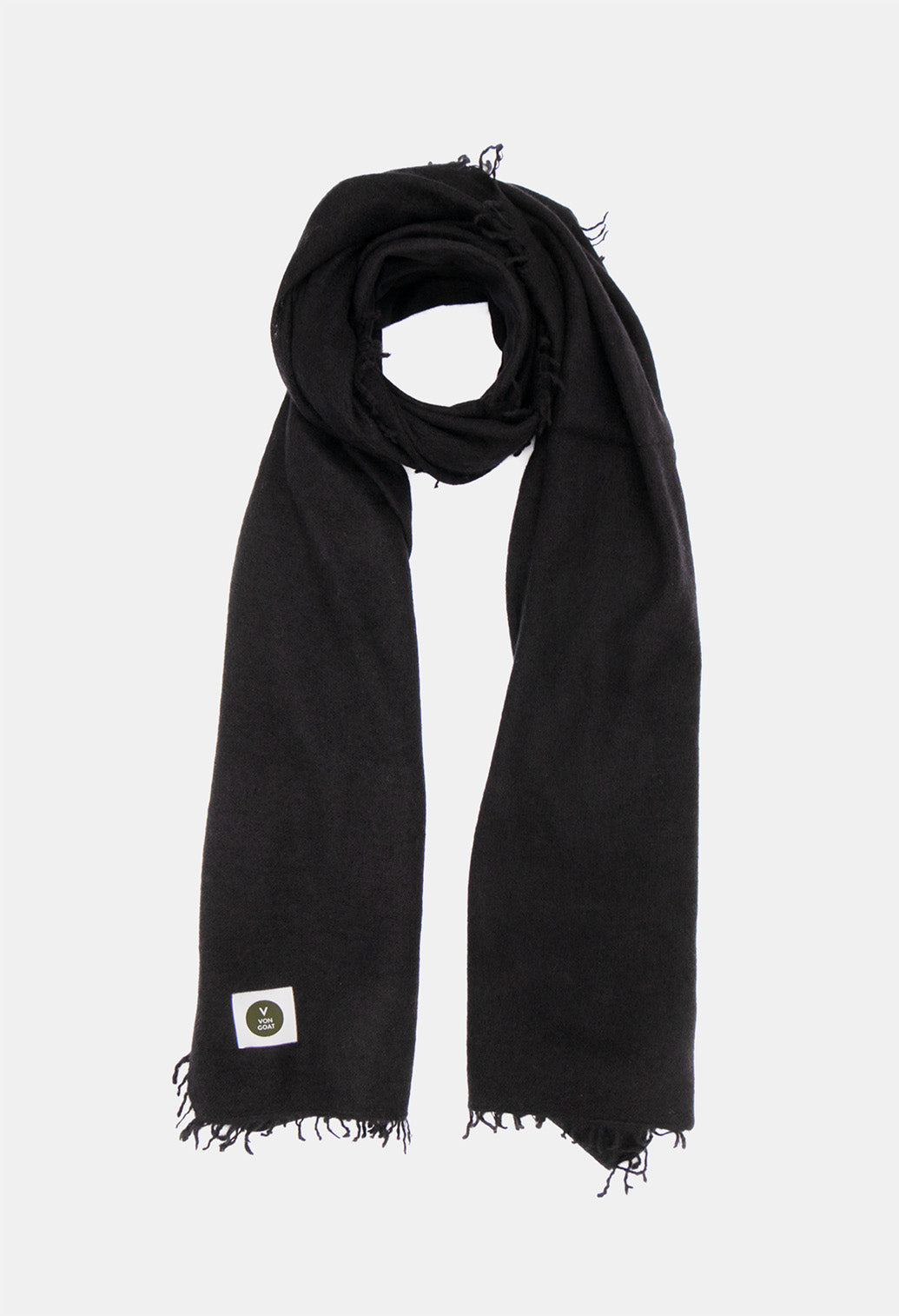 V Von Goat Kaschmir-Schal mit Fransen im Uni-Stil in den Farben Schwarz aus reiner Cashmere-Wolle auf weißem Untergrund.